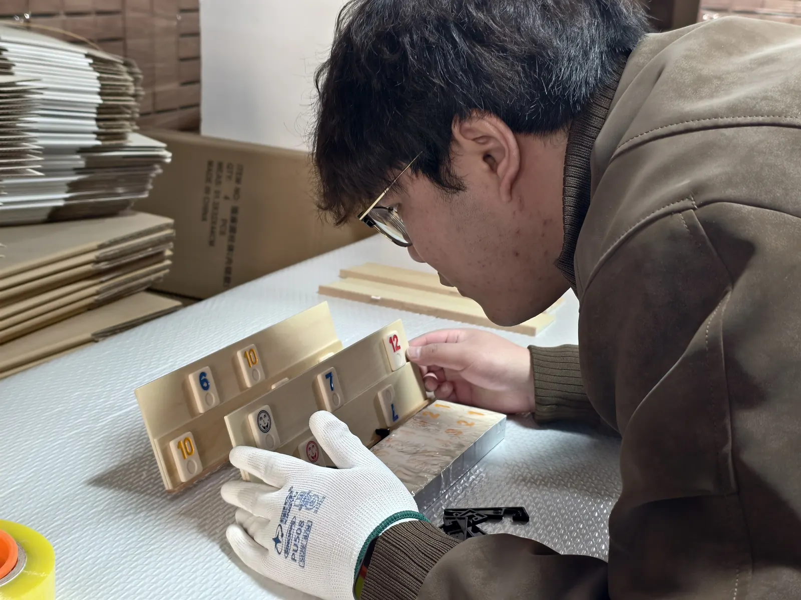 Owl Sourcing team member inspecting a product by hand