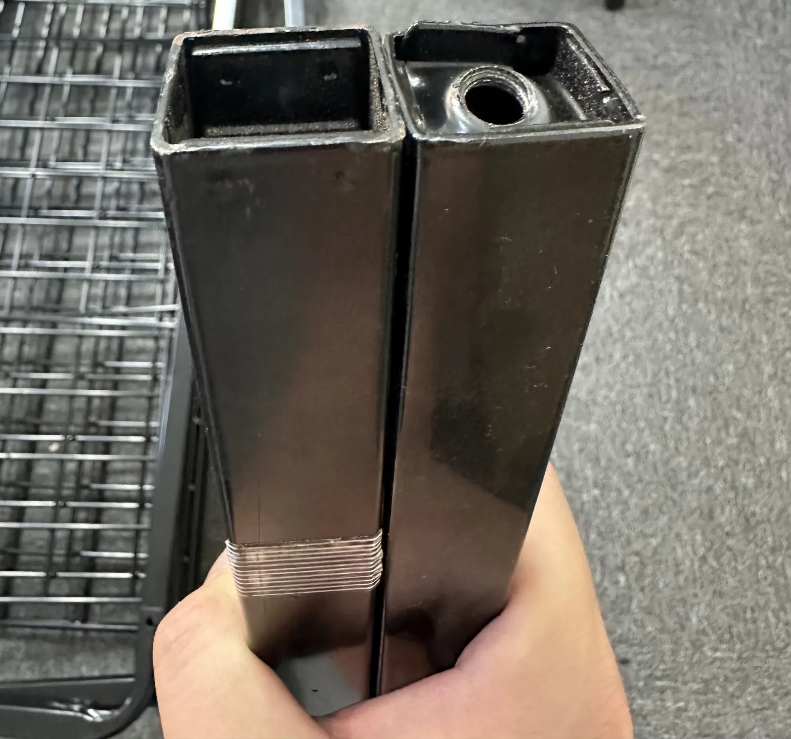 Square-tube cart legs checked at the ends, where the castors fit