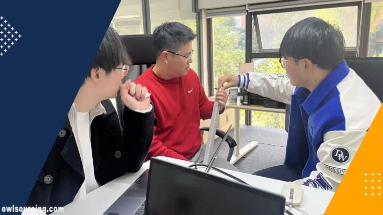 Owl Sourcing team in Shanghai reviewing a product sample at the office desk