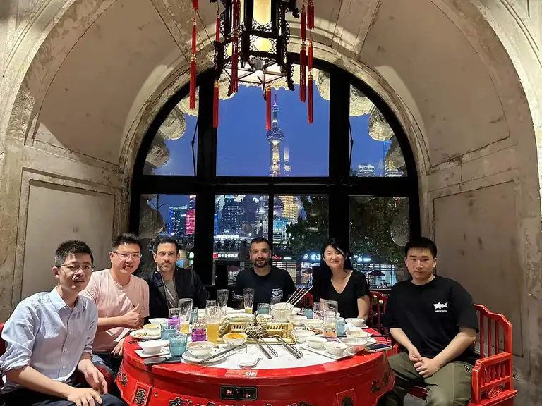 Owl Sourcing team in Shanghai having dinner with visiting clients by the Bund