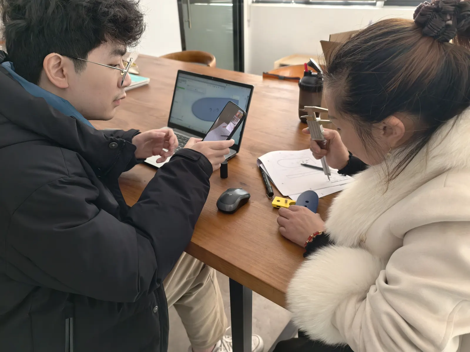 Owl Sourcing team reviewing a project together