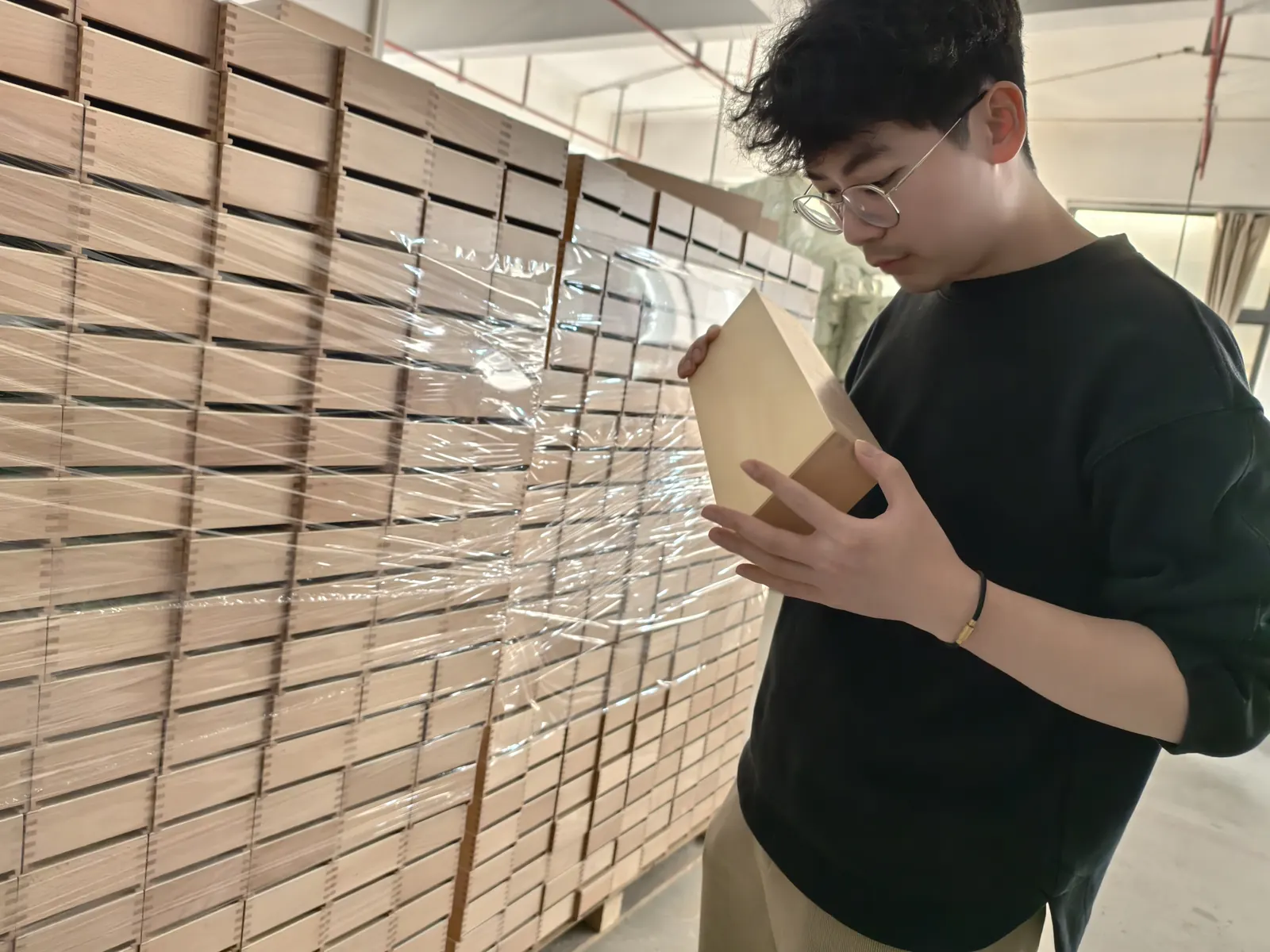 Owl Sourcing team member checking cartons before shipment